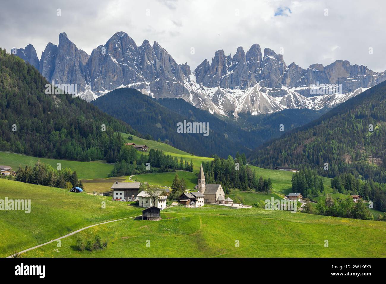 landscape of the village of St. Maddalena against the backdrop of the Dolomites ItalyDolomites Italy Stock Photo