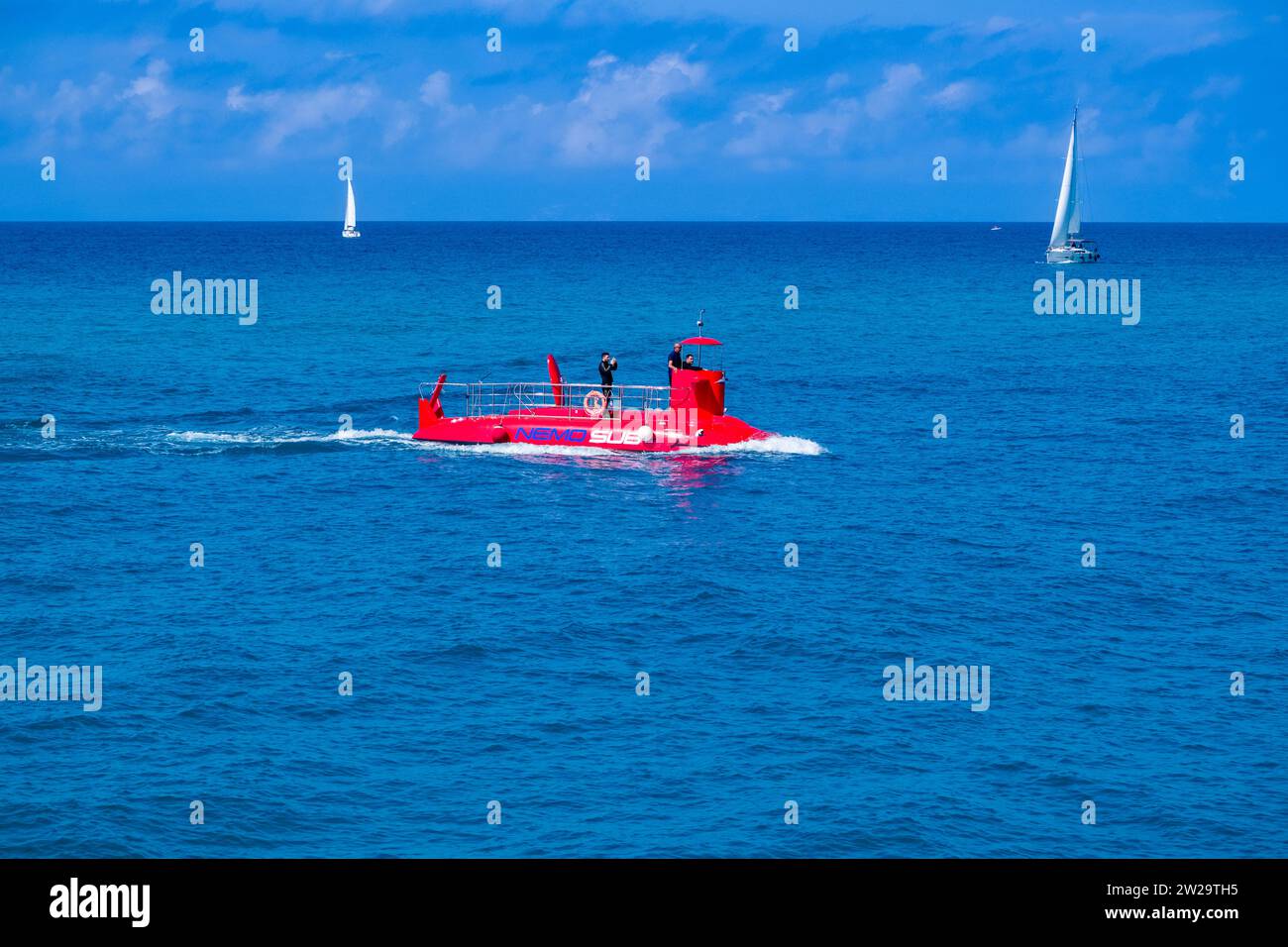 Nemo Sub, a submarine for tourist excursions, cruises off Tropea. Stock Photo