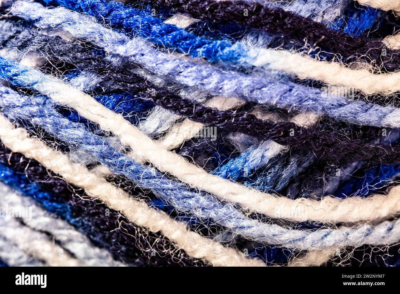 Close up semi abstract still life of blue and white wool showing