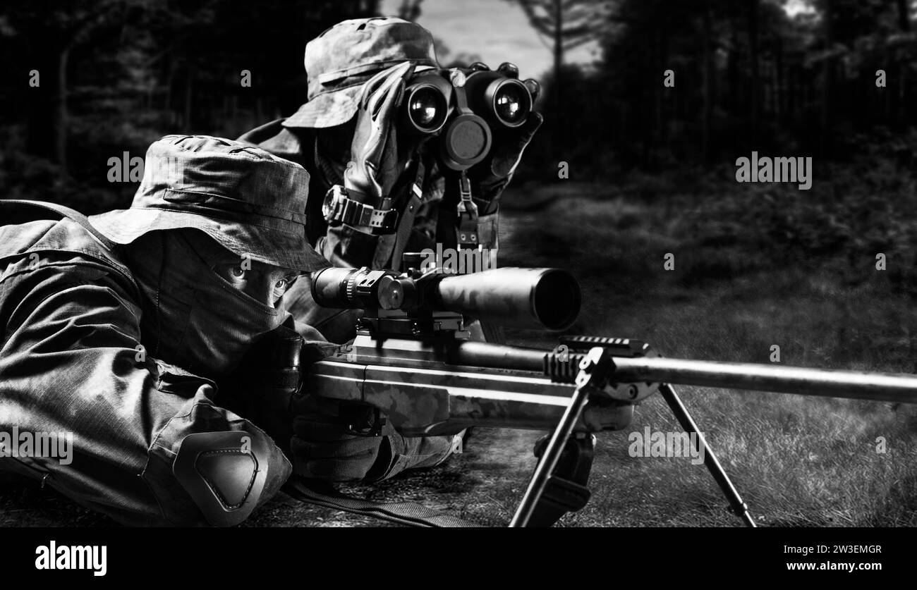 Sniper together with the gunner took the position and expect the target. Mixed media Stock Photo
