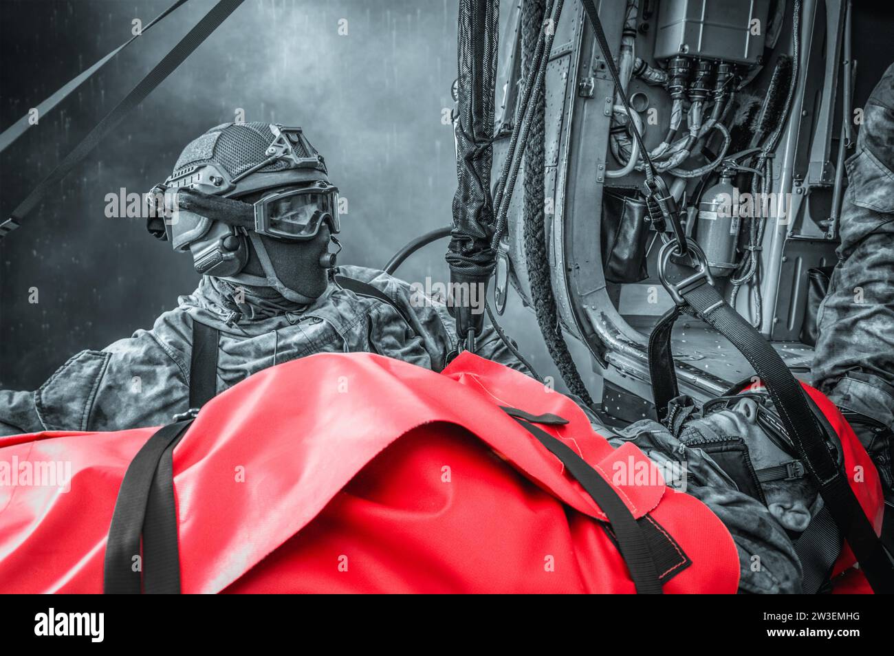 Evacuation of a wounded soldier by helicopter. The victim lies on a