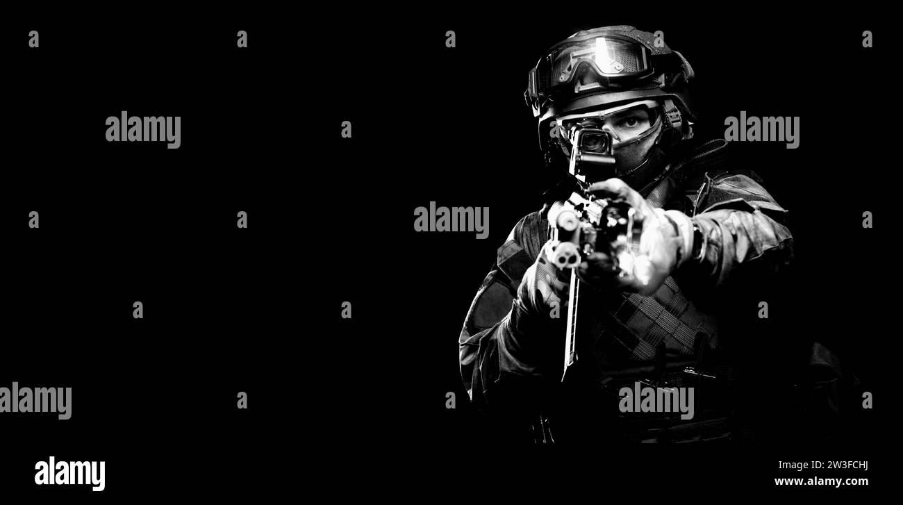 Portrait of a special forces soldier who is aiming at a collimator sight of a machine gun. The concept of special military units. Computer games. Stock Photo