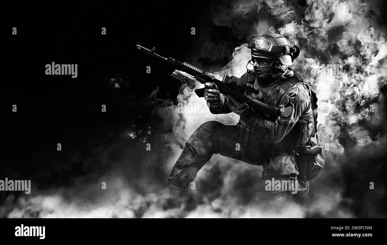 Portrait of a special forces soldier who reloads an assault rifle. The