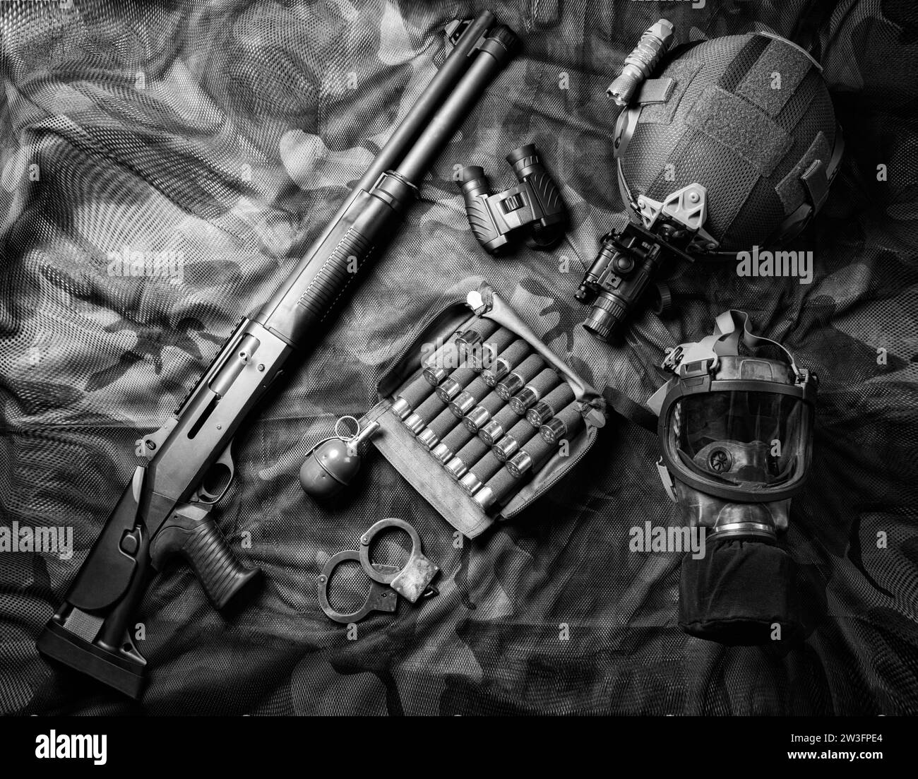 Set of weapons of a fighter of a special unit. Shotgun, ammo, grenade