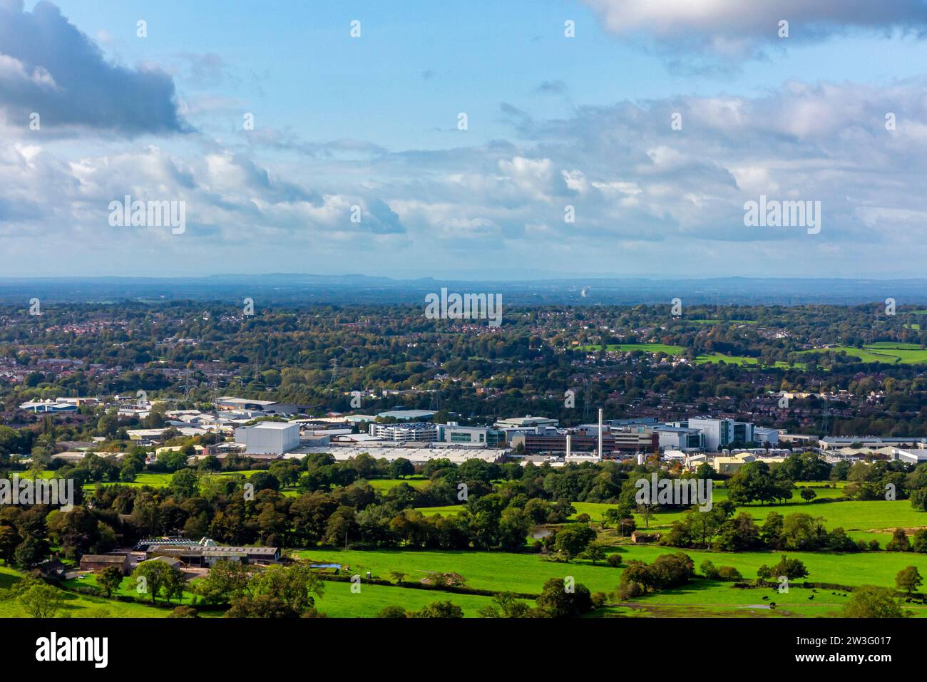 View looking down on the Astra Zeneca factory in Macclesfield Cheshire England UK with the Cheshire Plain and Jodrell Bank visible in the distance. Stock Photo