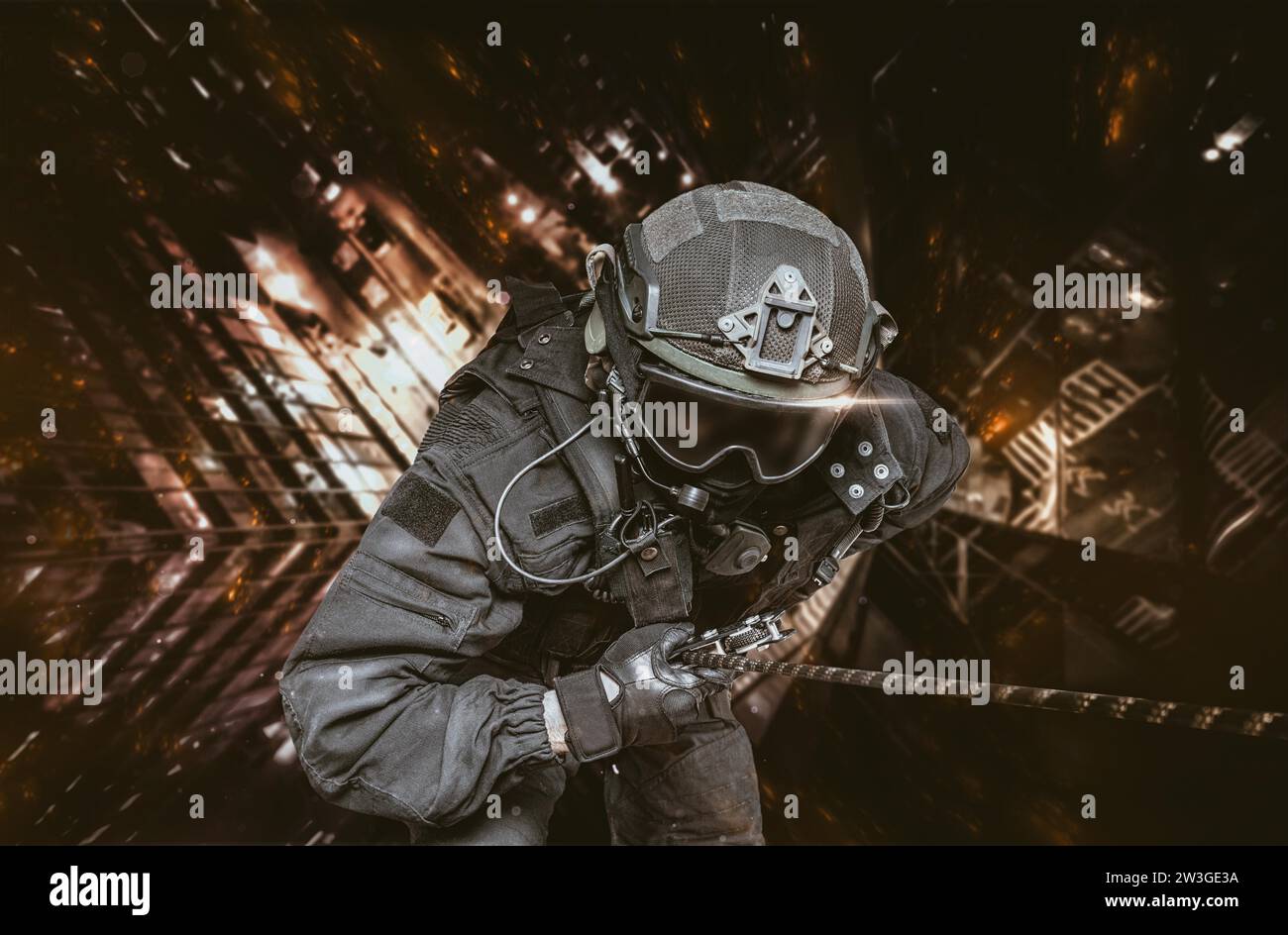 Rescuer descends from a skyscraper to save people from the fire. The concept of cataclysms, tragedies, fires. Mixed media Stock Photo