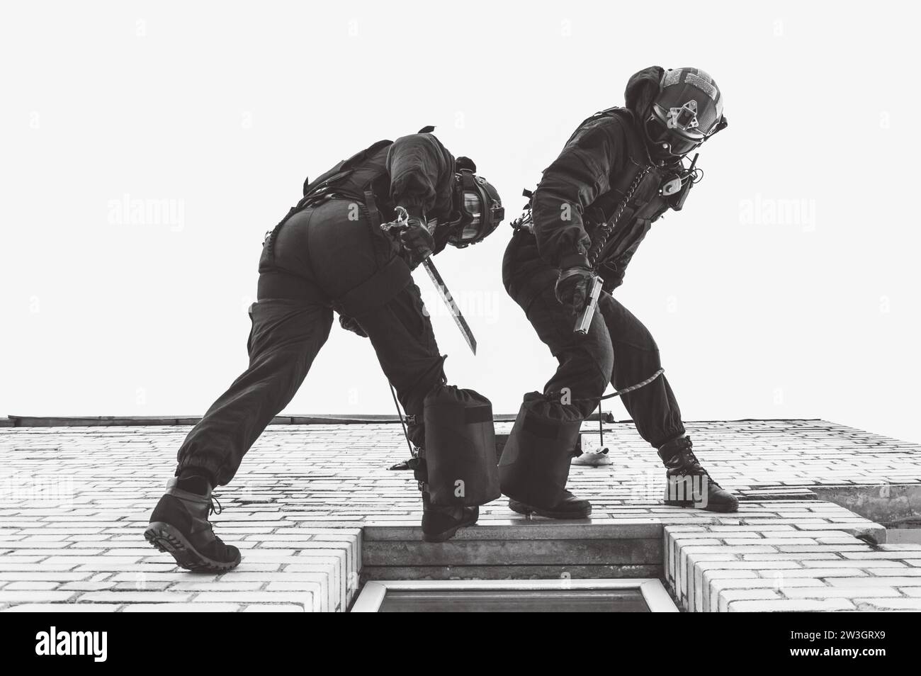 Two commandos train at the base. Climbers. SWAT, police, counterterrorism concept. Mixed media Stock Photo