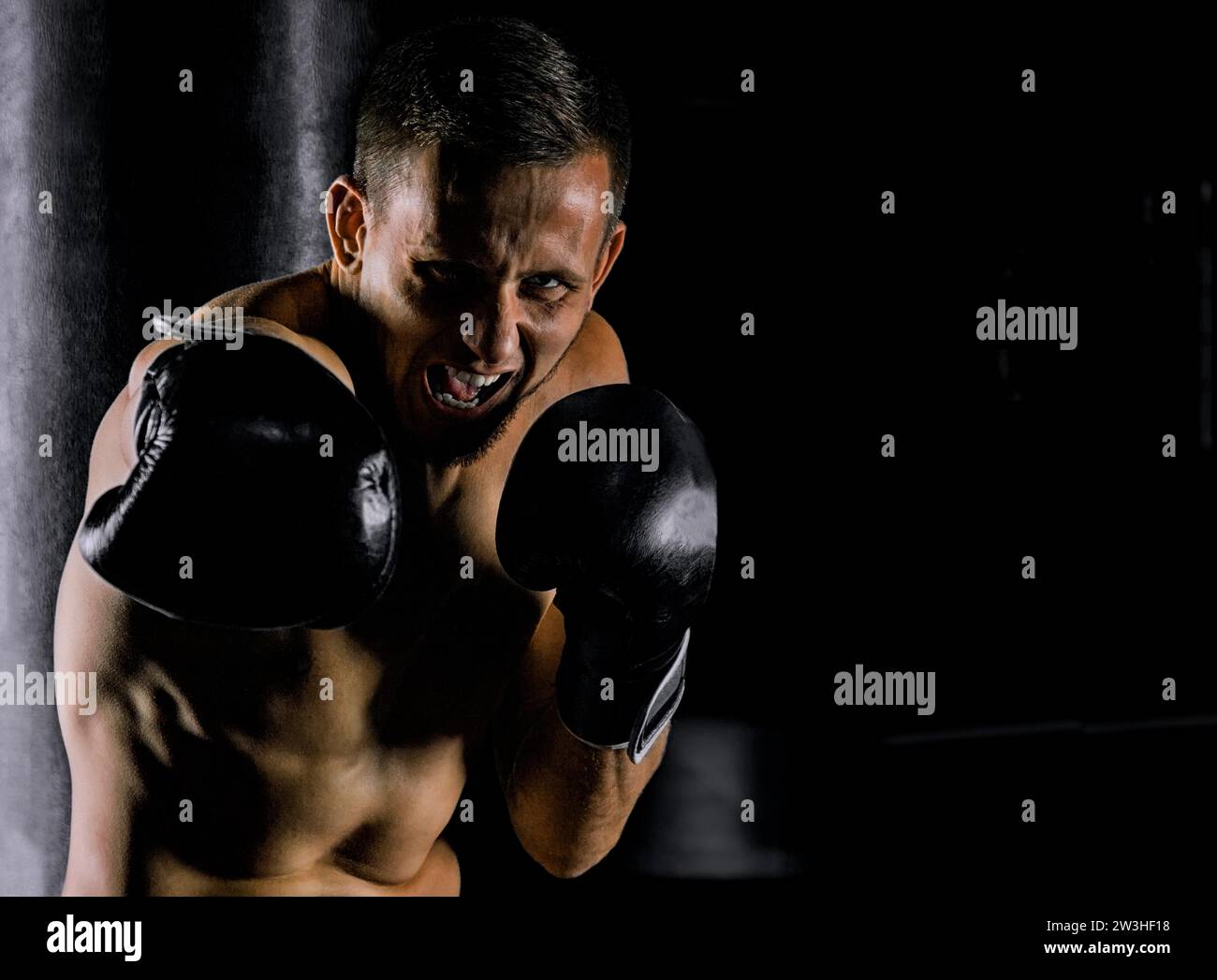 Professional sportsman of mixed martial arts stands in the fighting