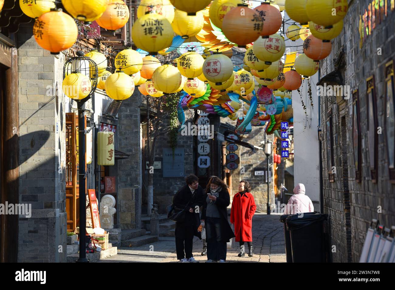 Nanjing, China. 21st Dec, 2023. Citizens are walking in the Old Gate East scenic area, which is decorated with lanterns of various styles, in Nanjing, China, on December 21, 2023. (Photo by Costfoto/NurPhoto) Credit: NurPhoto SRL/Alamy Live News Stock Photo
