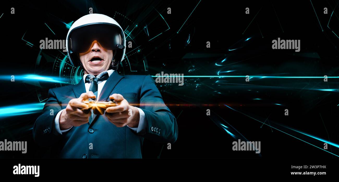 Portrait of a man in a suit and helmet of a pilot with a joystick in his hands. He enthusiastically plays a computer game. Game space. Game concept. Stock Photo