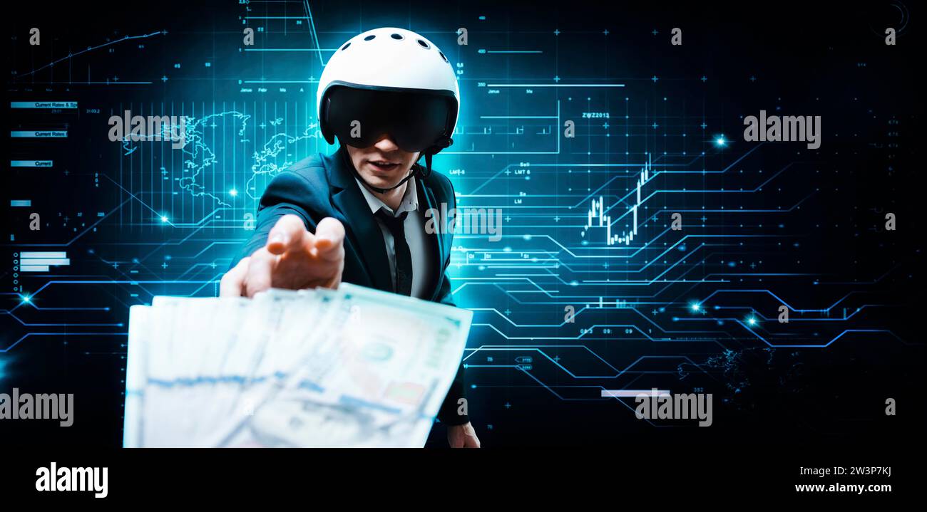 Portrait of a businessman in a suit and aviator helmet. He is trying to reach a pack of hundred-dollar bills. Business concept. Mixed media Stock Photo