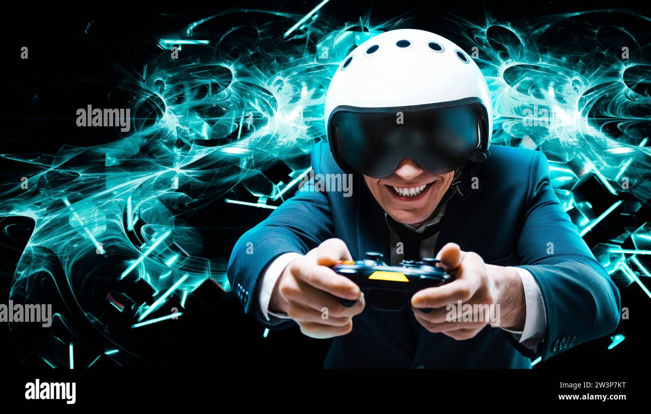 Portrait of a man in a suit and helmet of a pilot with a joystick in his hands. He enthusiastically plays a computer game. Game space. Game concept. Stock Photo