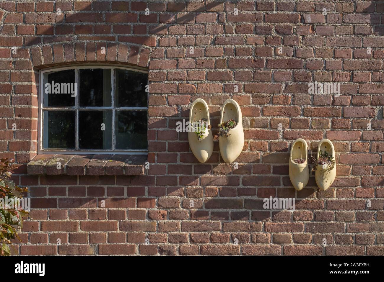 Wooden shoes as decoration on a stable wall, Netherlands Stock Photo