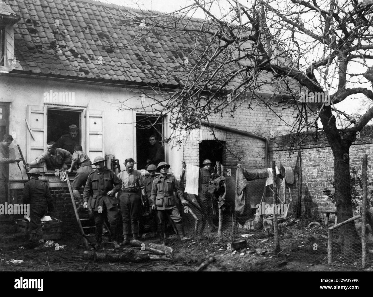 Official photograph taken on the British Western Front showing soldiers cleaning clothes and equipment Stock Photo