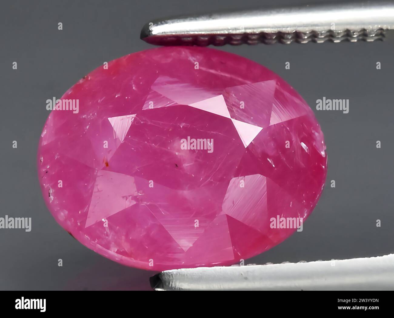 natural pink sapphire gem on background Stock Photo