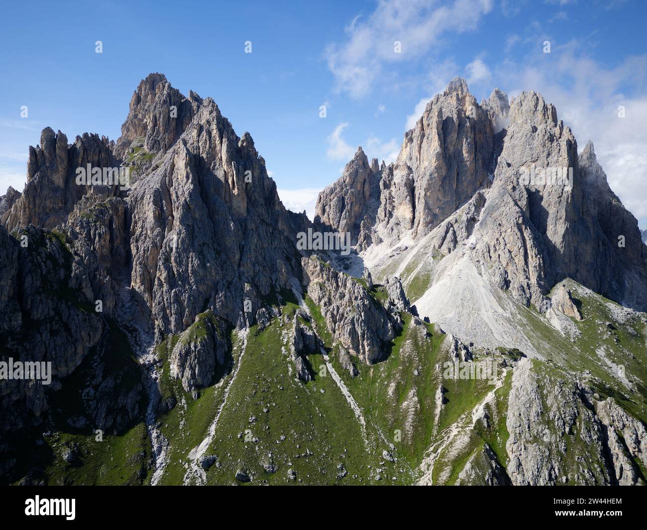 Aerial view of Cadini di Misurina mountains during a sunny day with some clouds. Dolomites, Italy. Dramatic and cinematic landscape Stock Photo