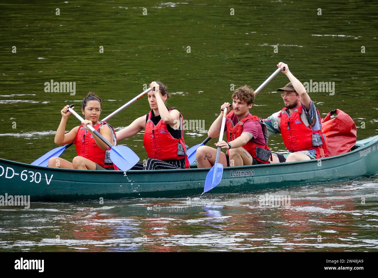 Friends Canoeing Elbe River People canoeing Summer Elbe River Germany Twenties People 20s young adults Germany Activities women Men Together paddling Stock Photo