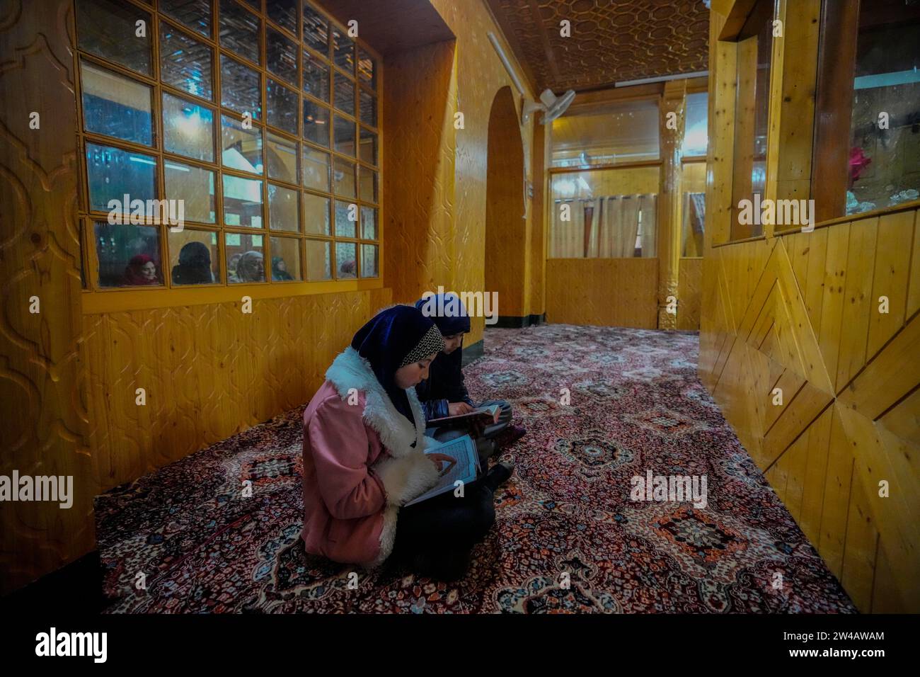 Muslim devotees recite the holy Quran inside the shrine of Sufi saint ...