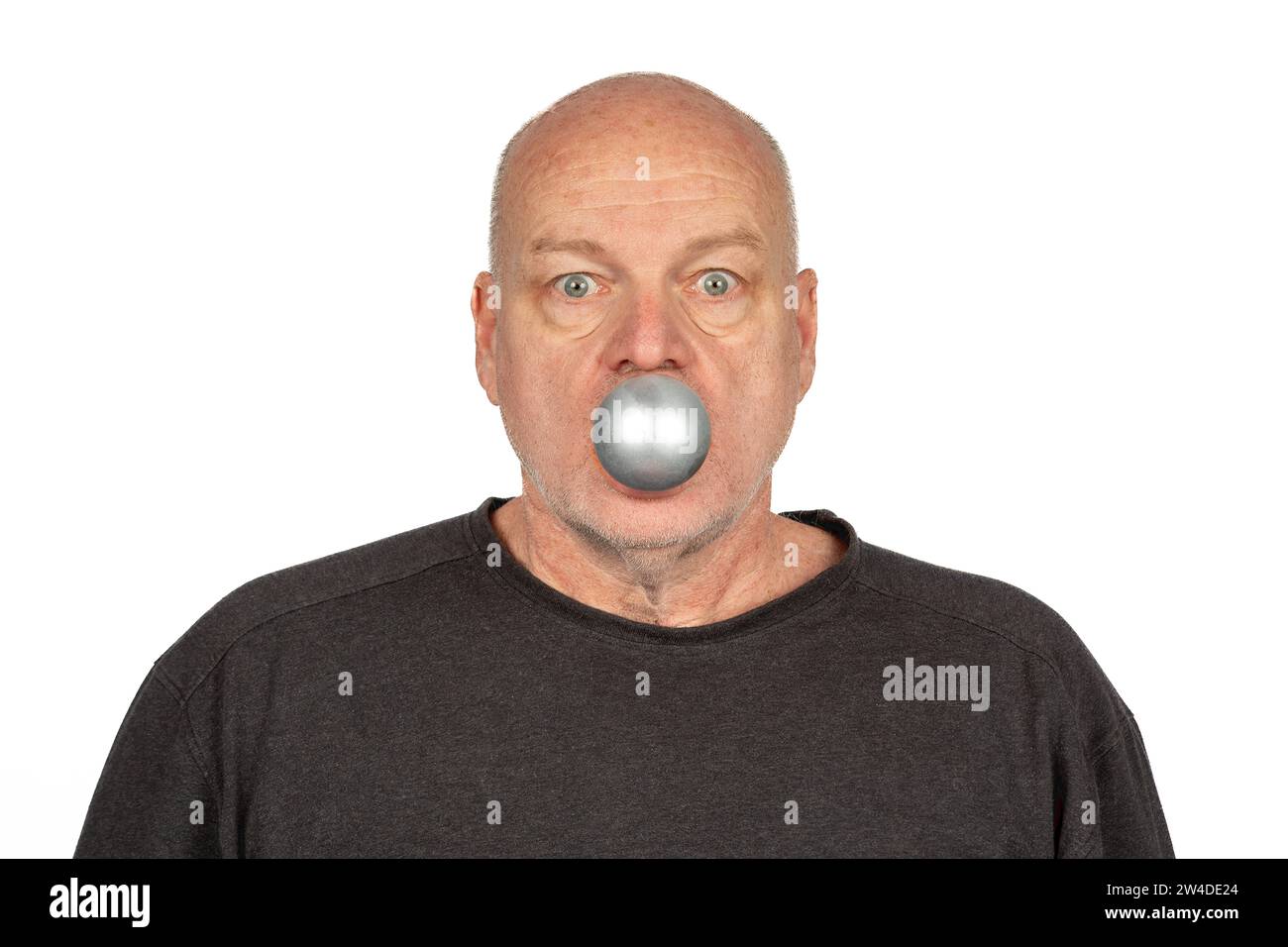 Merry Christmas: Smiling 58-Year-Old Caucasian Man with Silver Ornament in Mouth ,Copy Space Stock Photo