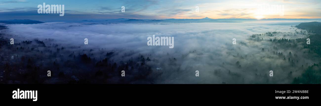 With Mt. Hood in the distance, dense fog covers the scenic Willamette Valley in Oregon, not far south of Portland. Stock Photo