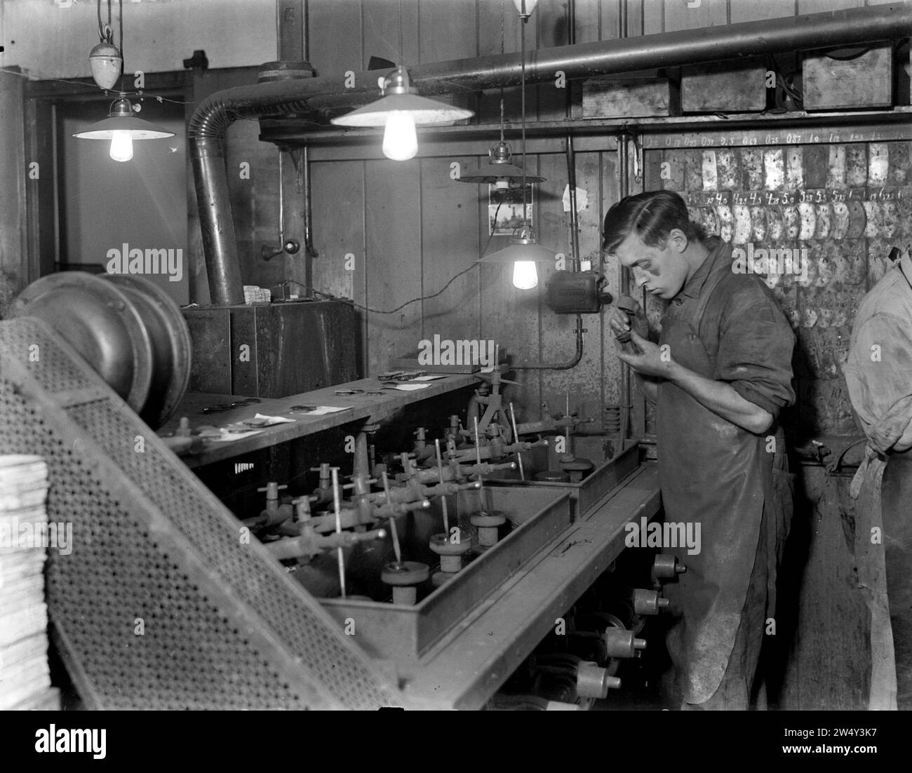 Manufacturing glasses lenses Black and White Stock Photos & Images - Alamy image.