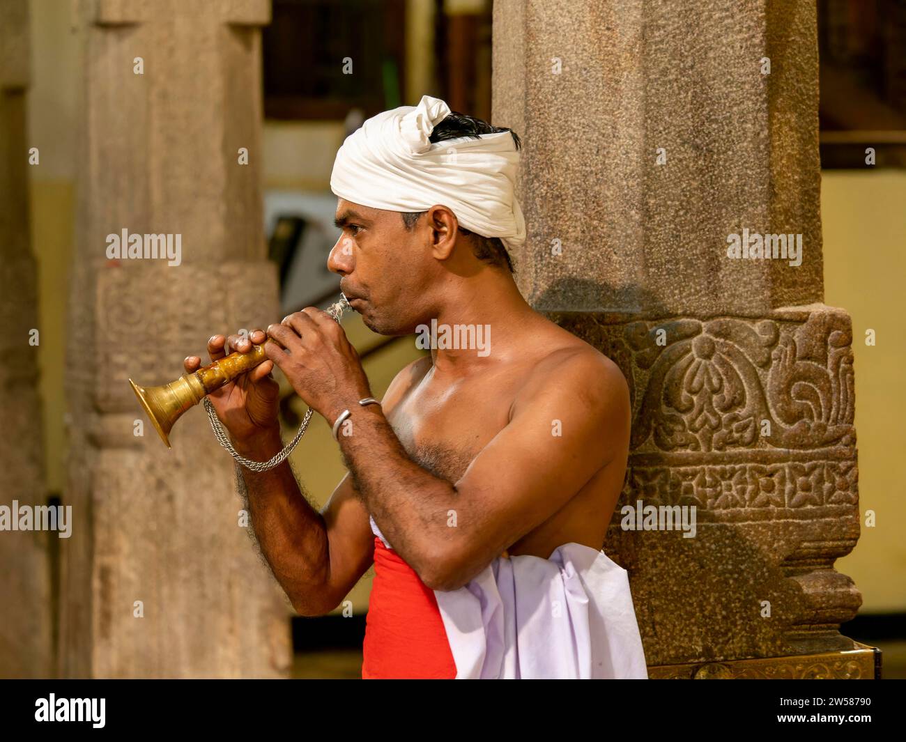 Man with wind instrument, Temple of the Tooth, Sri Dalada Maligawa