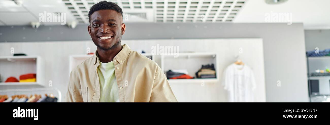 portrait of young african american owner of print studio smiling at ...