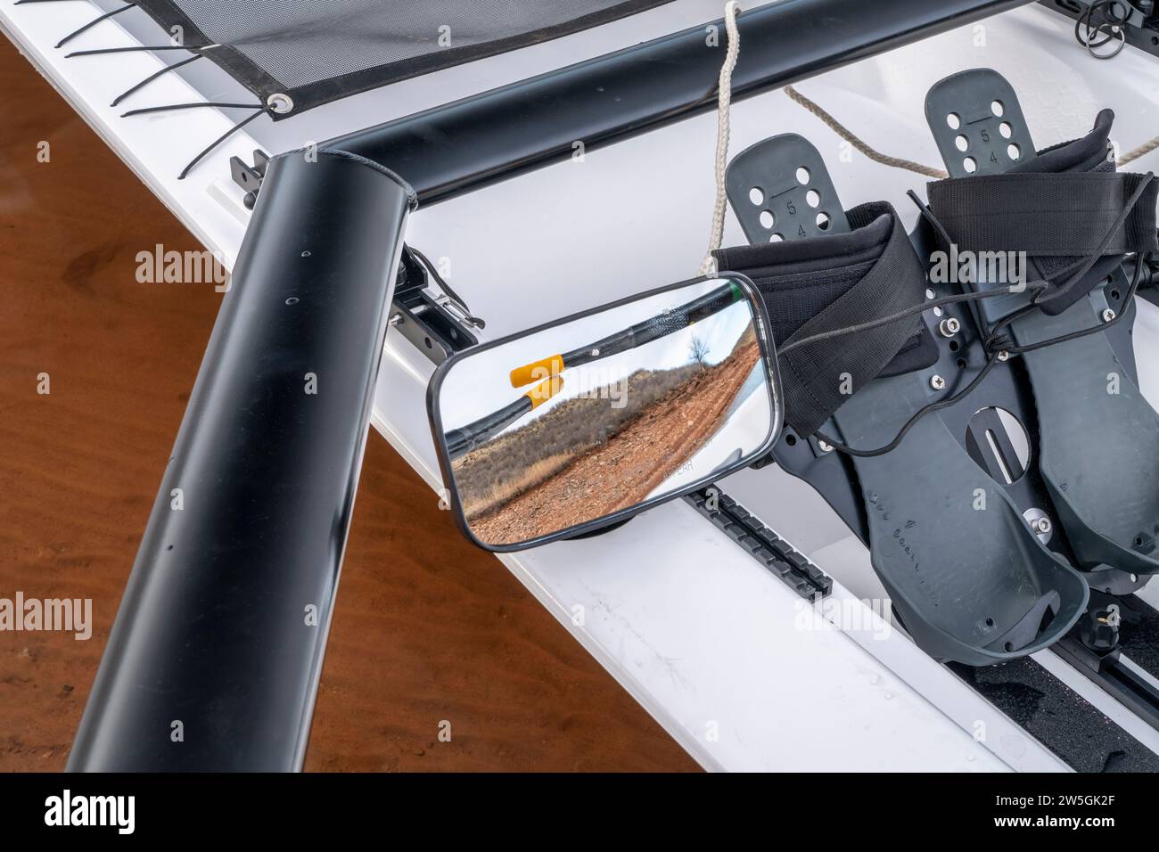 Detail of a coastal rowing shell with sculling oars, footstretcher and mirrow Stock Photo