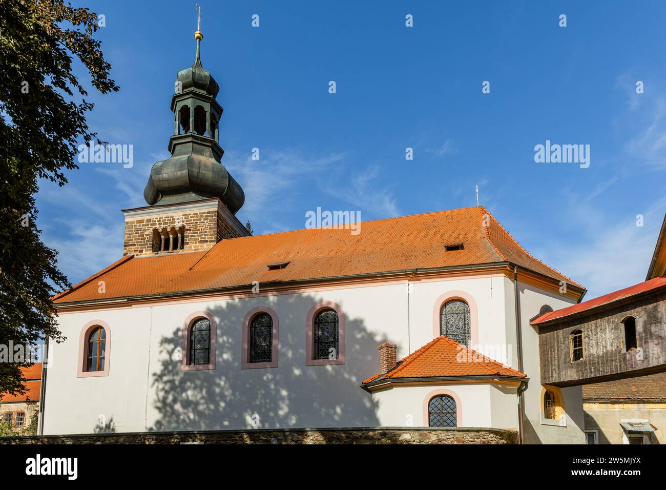Svojsin, Czech Republic - October 13 2023: View of the Saint Petr and Pavel church with the Romanesque stone tower, a chapel and a wooden courtyard Stock Photo