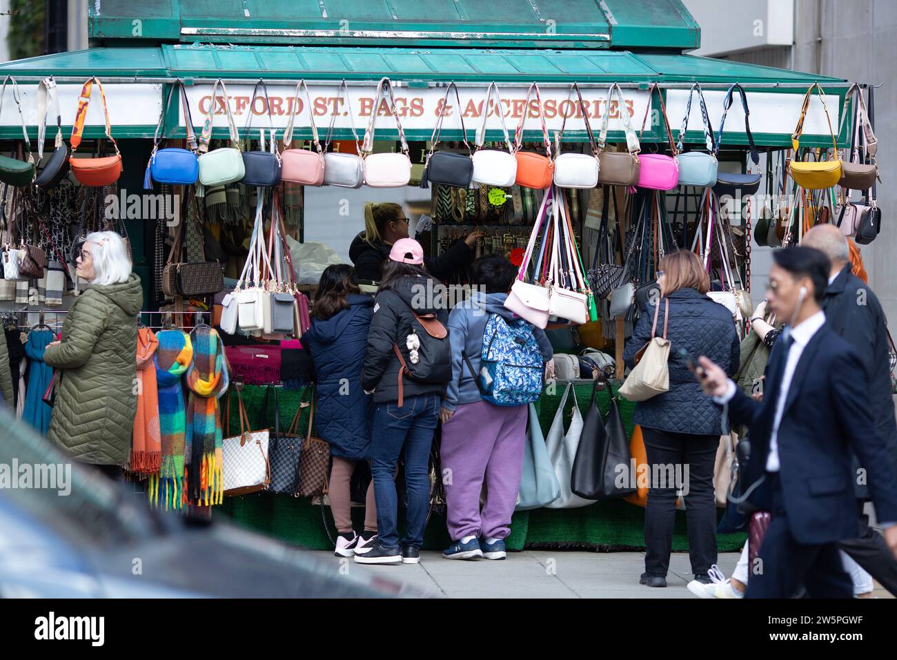 Shoppers walk on Oxford Street in central London, on Good Friday. Stock Photo