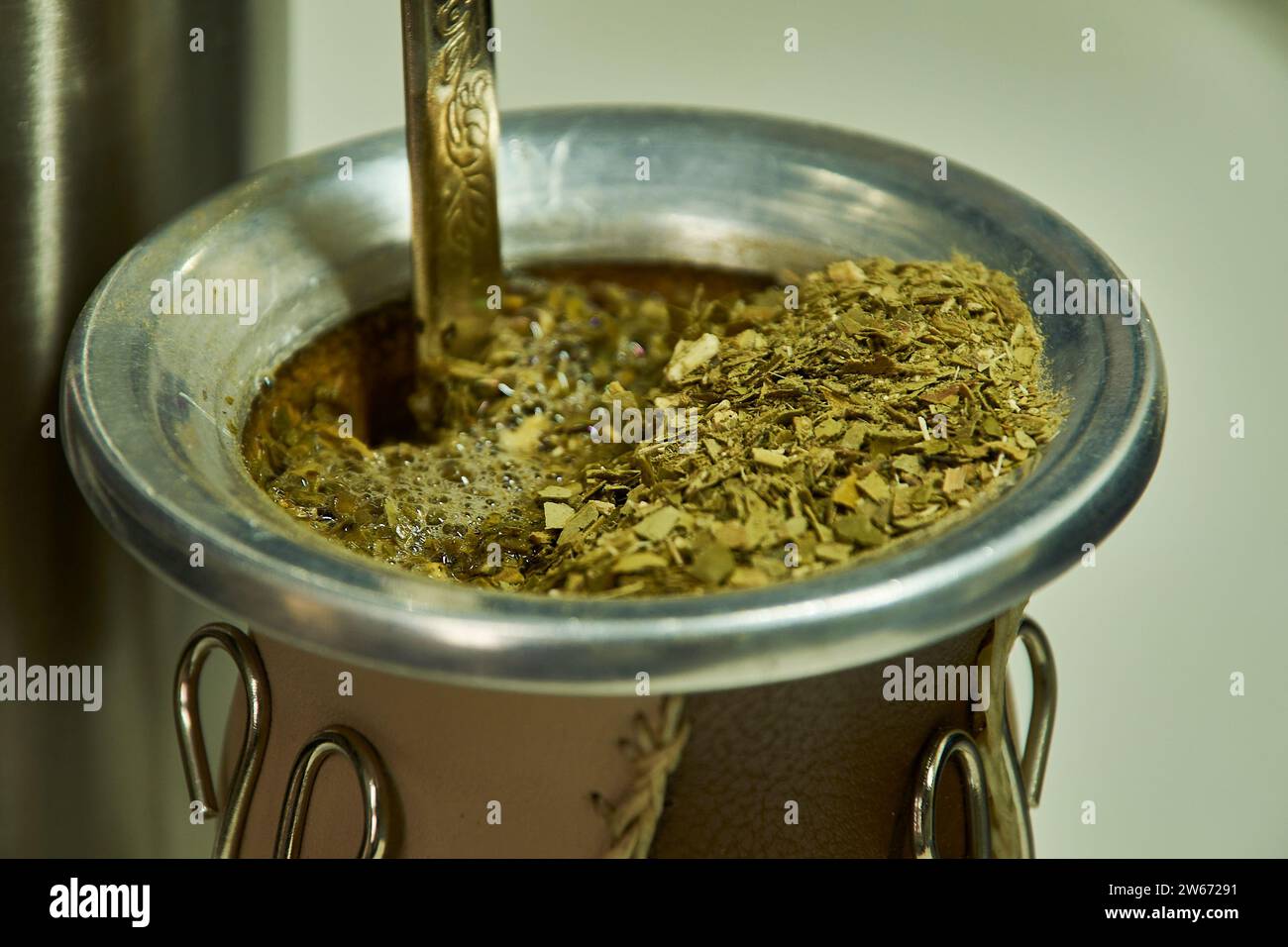 Yerba Mate in a gourd with bulb and thermos with water, traditional