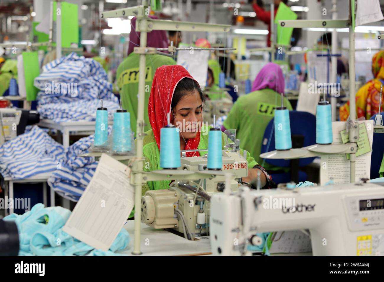 Readymade garments worker works in a garments factory in Dhaka, Bangladesh on December 21, 2023