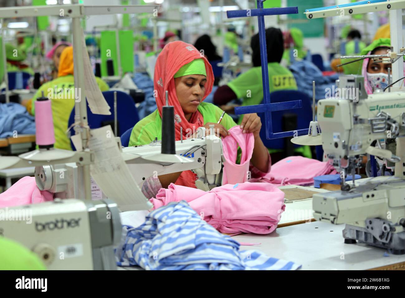 Readymade garments worker works in a garments factory in Dhaka, Bangladesh on December 21, 2023