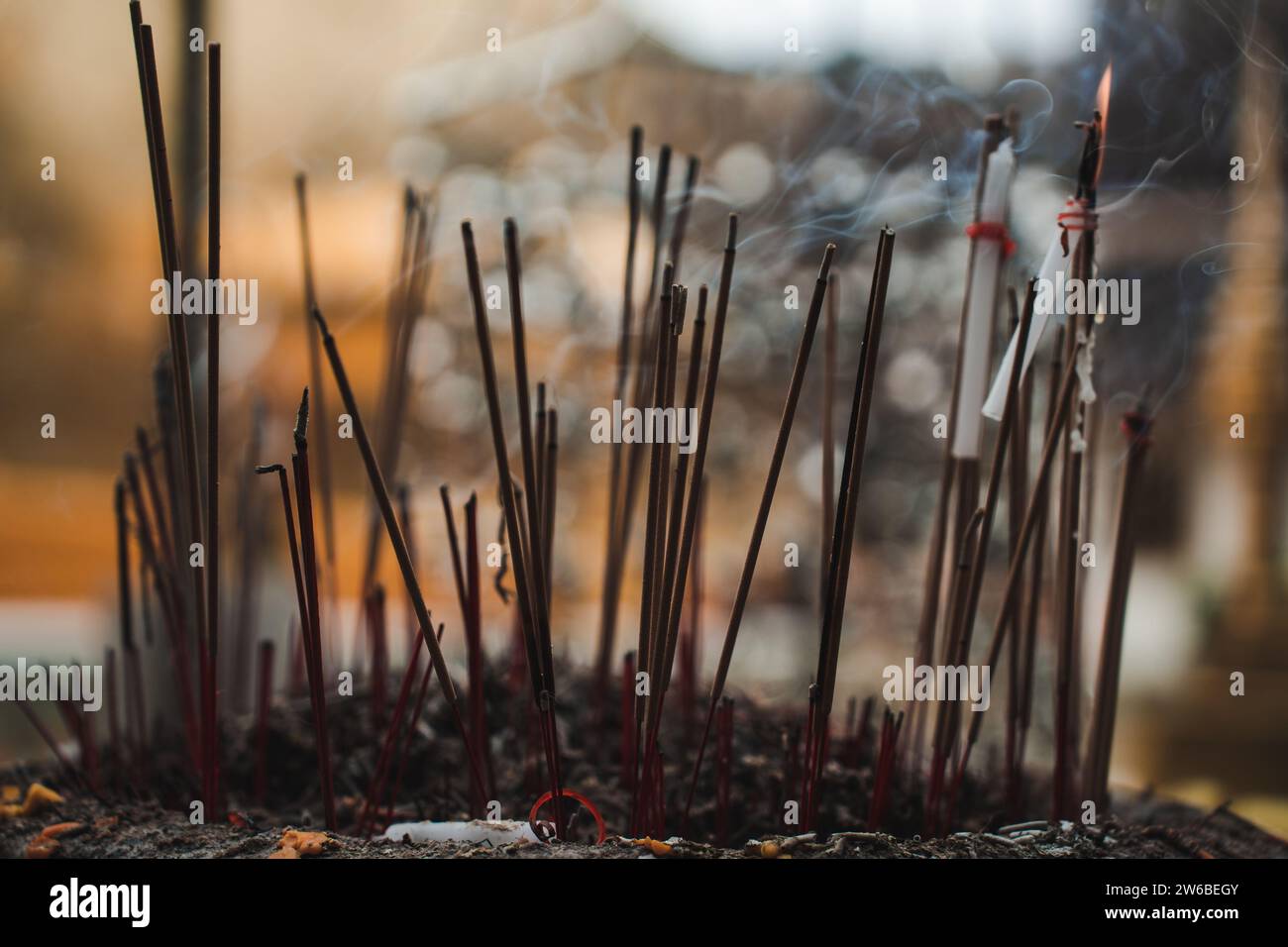 Incense sticks burning at buddhist temple in thailand hi-res stock ...