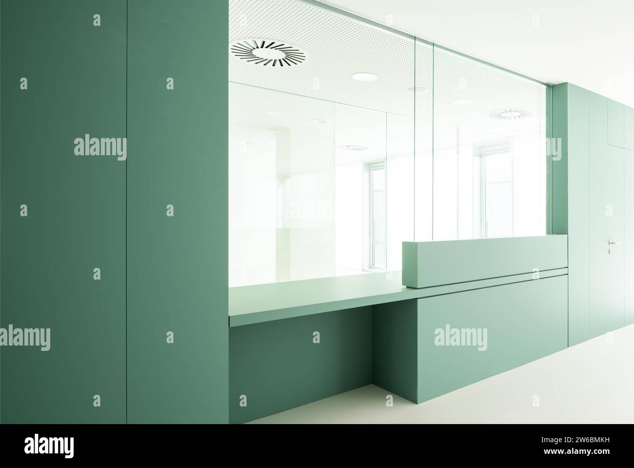 Interior of empty modern hospital with cabin and green walls Stock ...