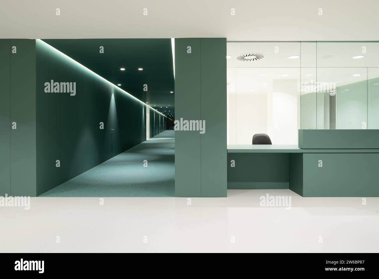 Interior of empty modern hospital with cabin and green walls near ...