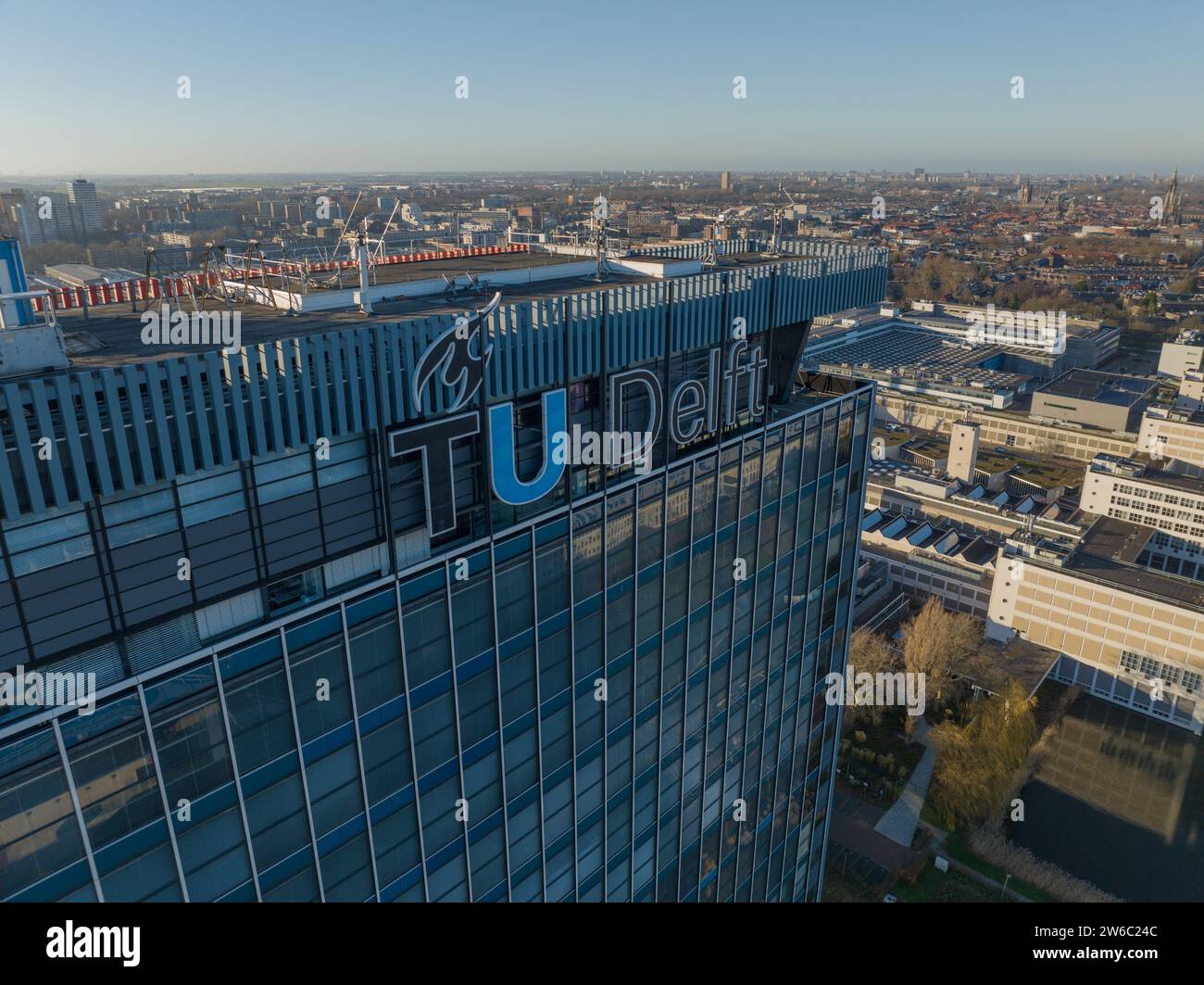 Delft, The Netherlands, December, 17, 2023. Facade of the TU Delft university campus in The Netherlands. Logo of TU Delft. Stock Photo