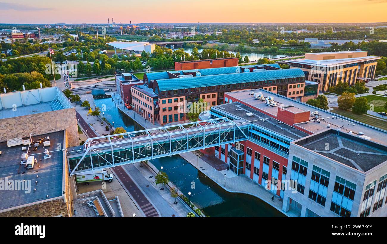Aerial Golden Hour Glow on Urban Canal and Modern Architecture Stock