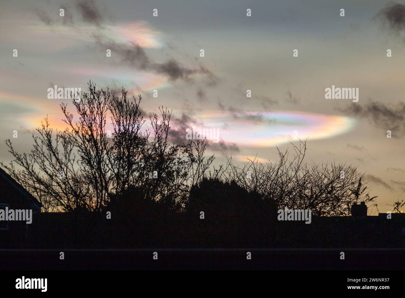 Stockton on Tees, UK. 21st December 2023.Rare 'mother of pearl” clouds in the sky over Fairfield. Also known as nacreous or polar stratospheric clouds. David Dixon / Alamy Stock Photo