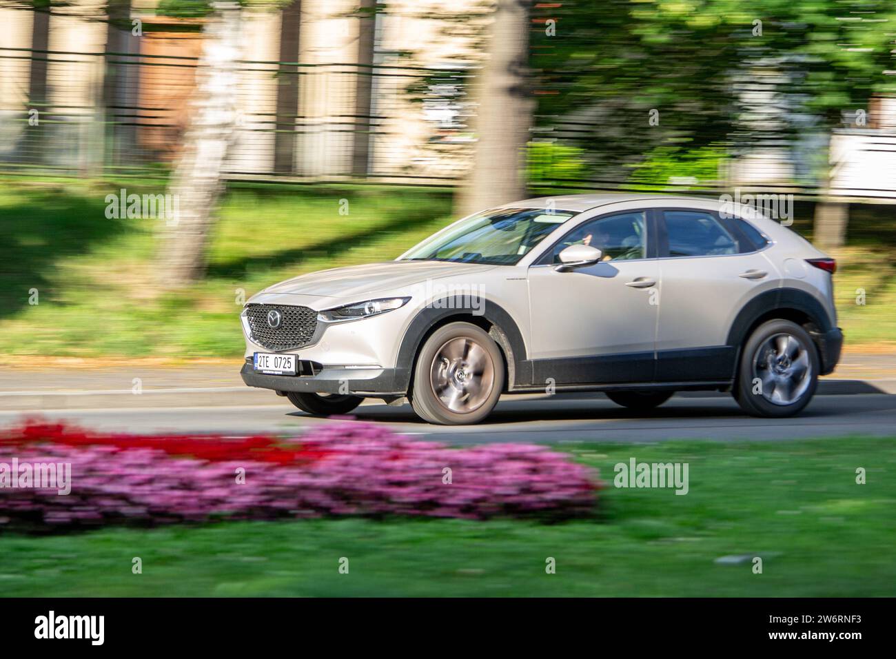 HAVIROV, CZECH REPUBLIC - JULY 27, 2023: Mazda CX-30 crossover driving quickly with motion blur effect Stock Photo