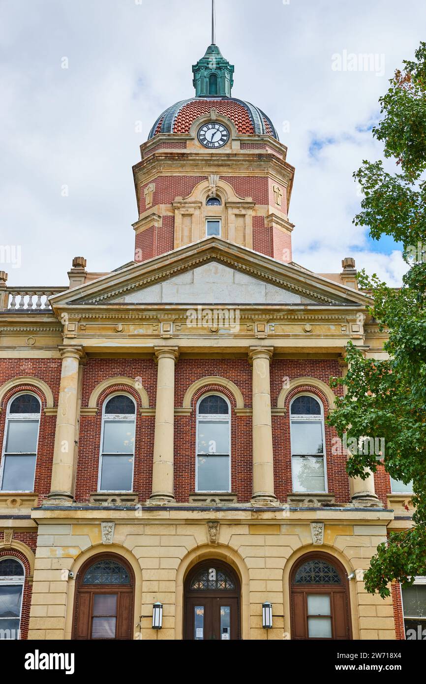 Front of Elkhart County courthouse on cloudy day with fluffy white