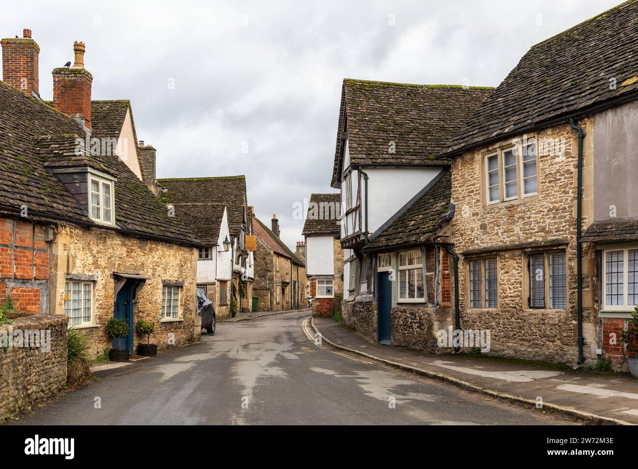 Traditional stone and half timber framed cottages in the National Trust village of Lacock in December, Wiltshire, England, UK Stock Photo