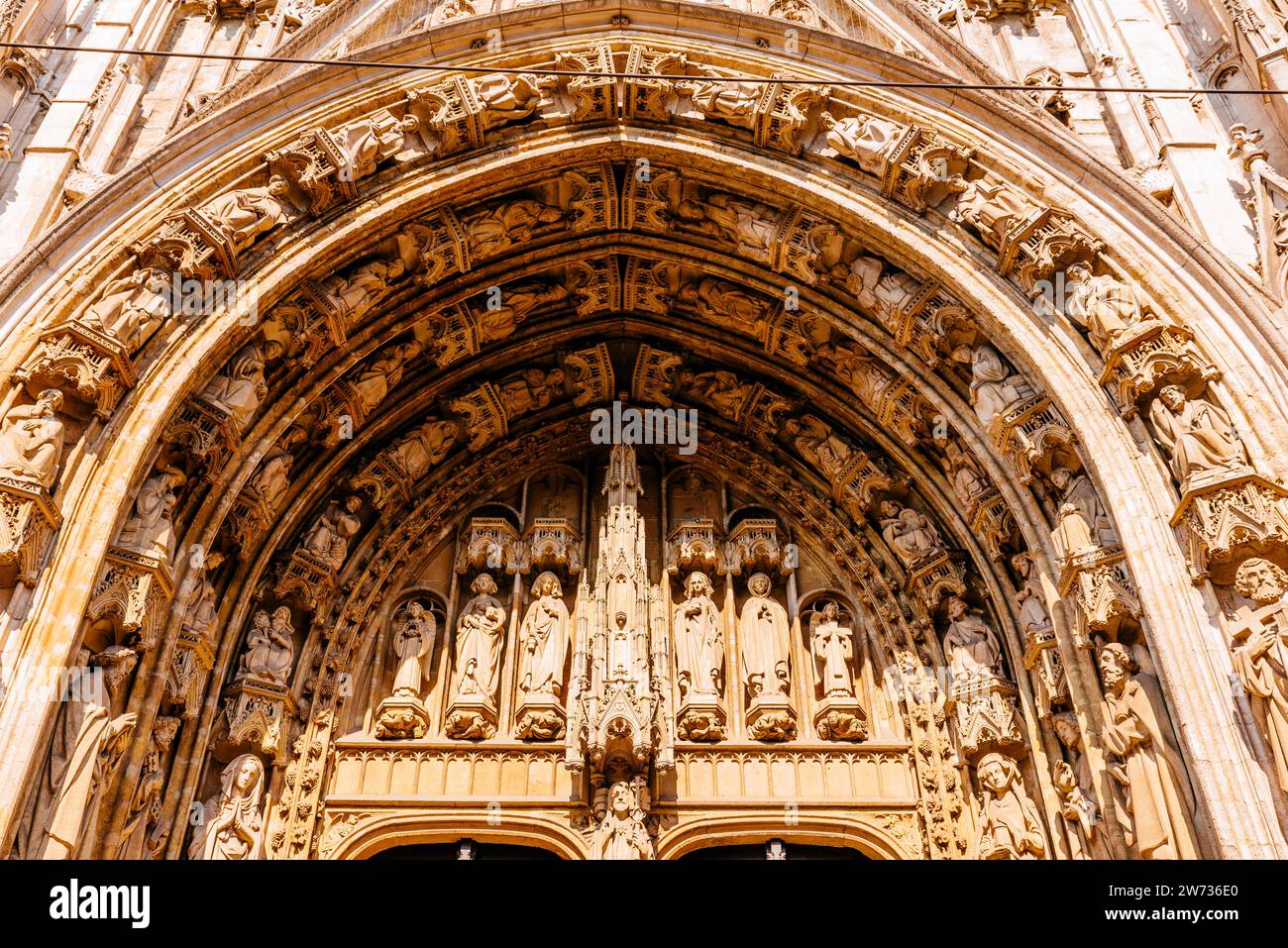 Detail of the side portal. Church of Our Blessed Lady of the Sablon is a Roman Catholic church located in the Sablon-Zavel district, in the historic c Stock Photo