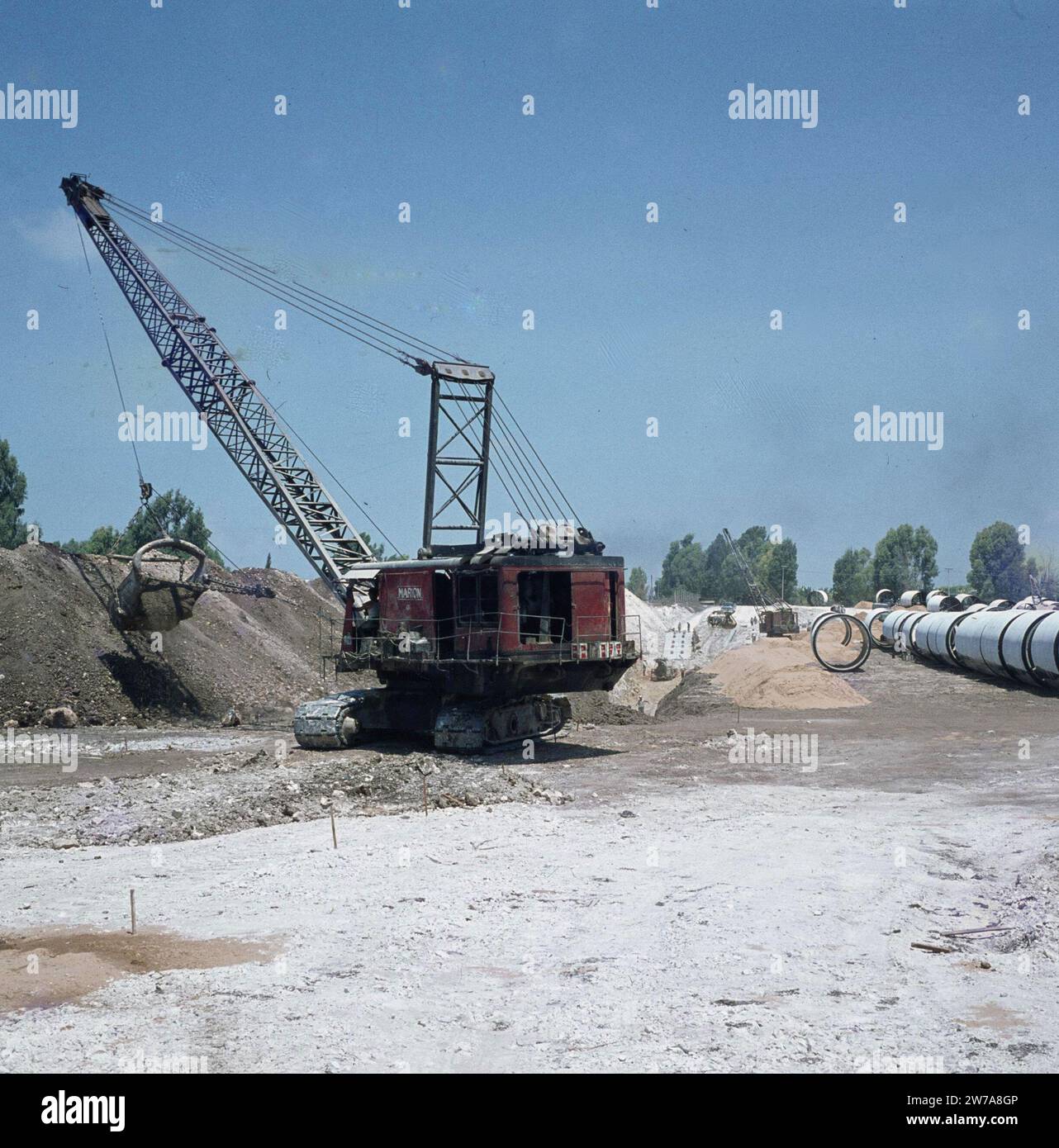 Construction of irrigation works in the Negev desert. Draglines and
