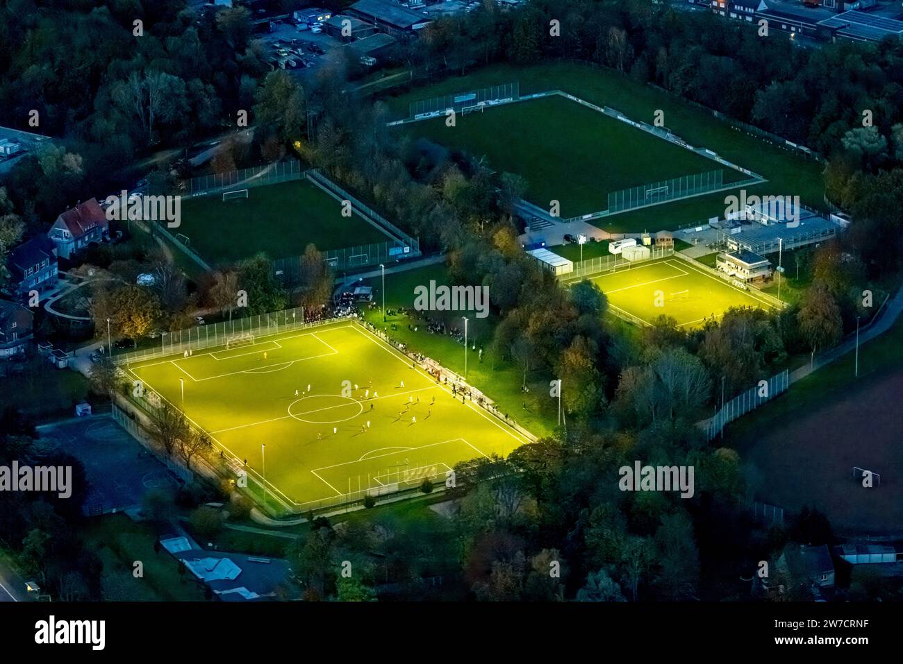 Aerial view, night shot, soccer match in the illuminated Adolf-Brühl-Stadium of the Sport Gemeinschaft Bockum-Hövel 2013 e.V., surrounded by autumnal Stock Photo