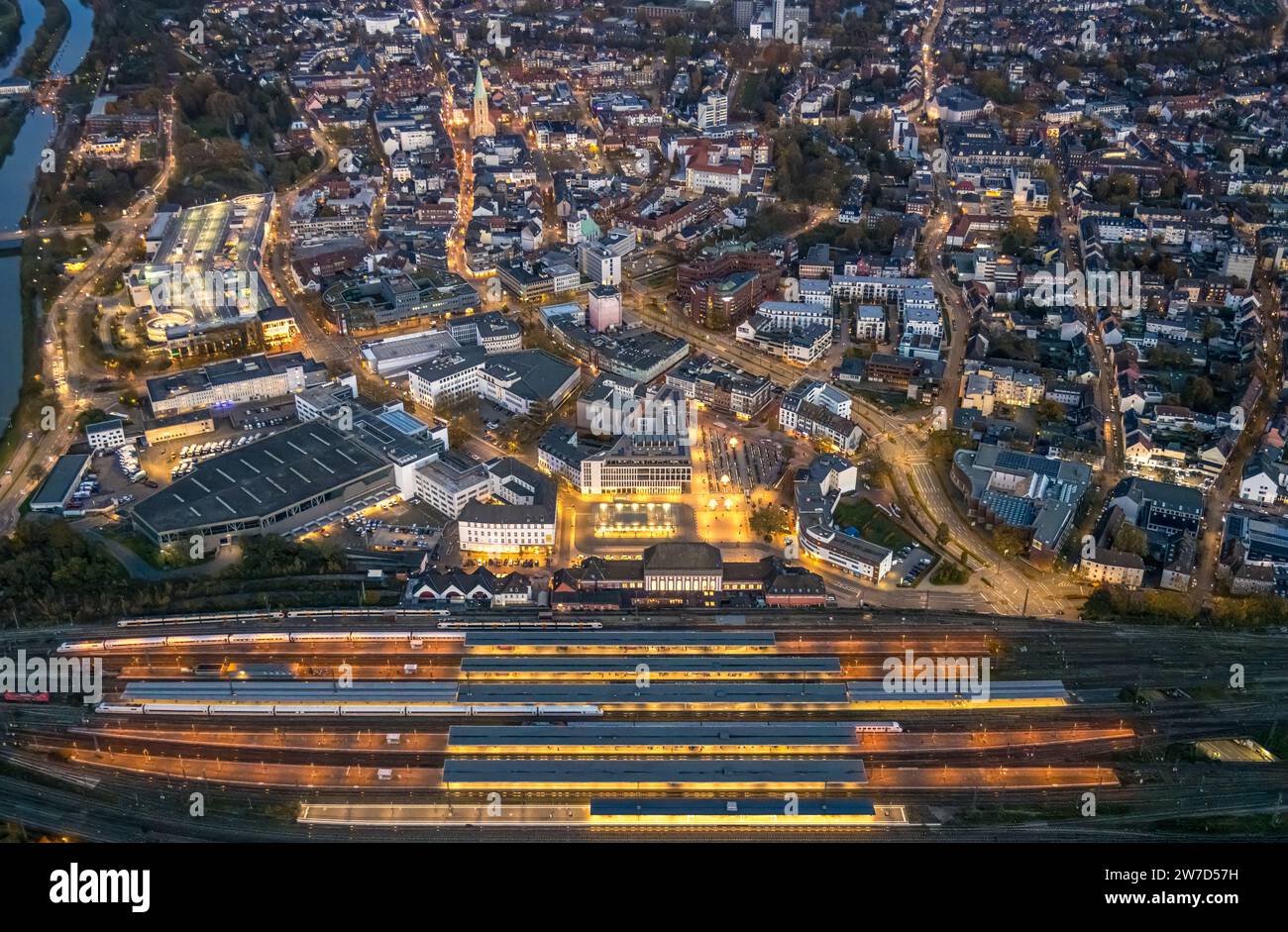 Aerial view, night shot, central station Hbf with station forecourt and city with Allee-Center shopping center, view to the evang. Pauluskirche, cente Stock Photo