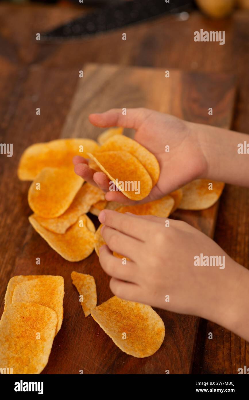 Potato chip adventure: creative snack time with a child's touch. Stock Photo