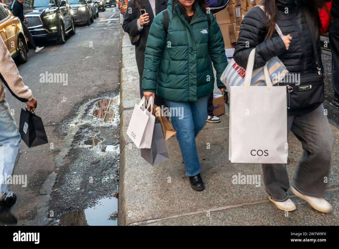 Shoppers in the Soho neighborhood of New York on Saturday, December 16, 2023. The National Retail Federation is predicting that holiday spending will reach record spending levels during November and December growing between 3% and 4% over last year. (© Richard B. Levine) Stock Photo