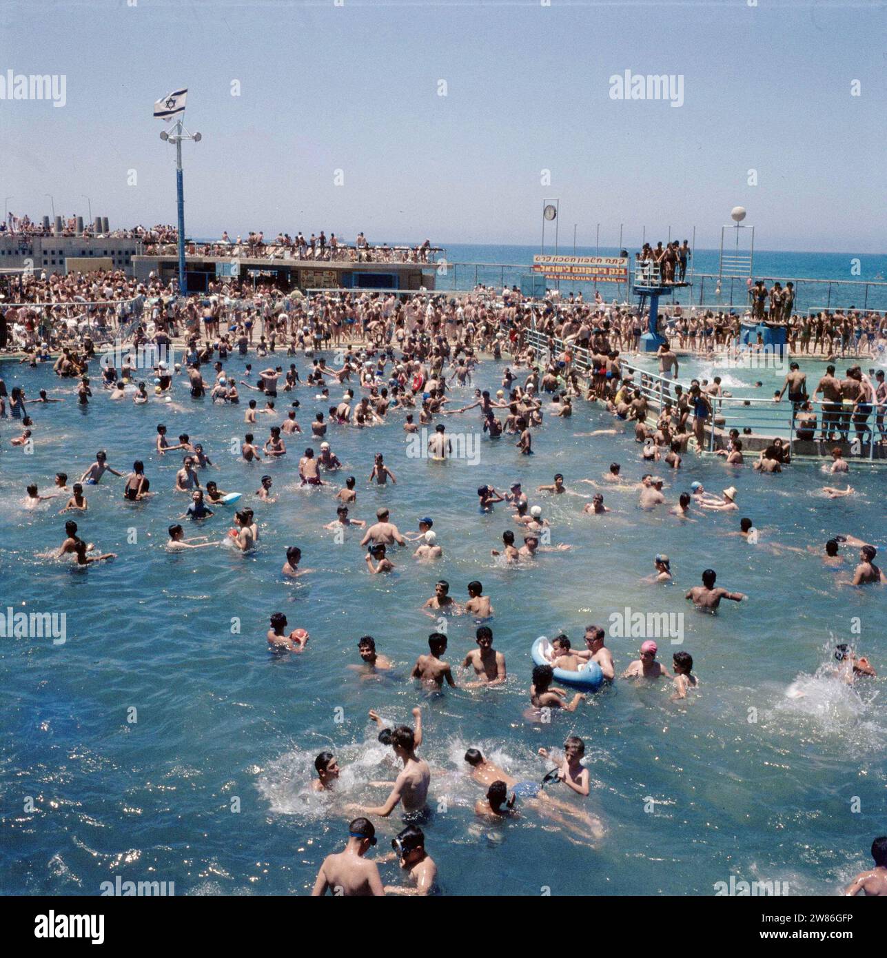 Tel Aviv. The overcrowded outdoor swimming pool on the boulevard overlooking the Mediterranean Sea ca. undated Stock Photo