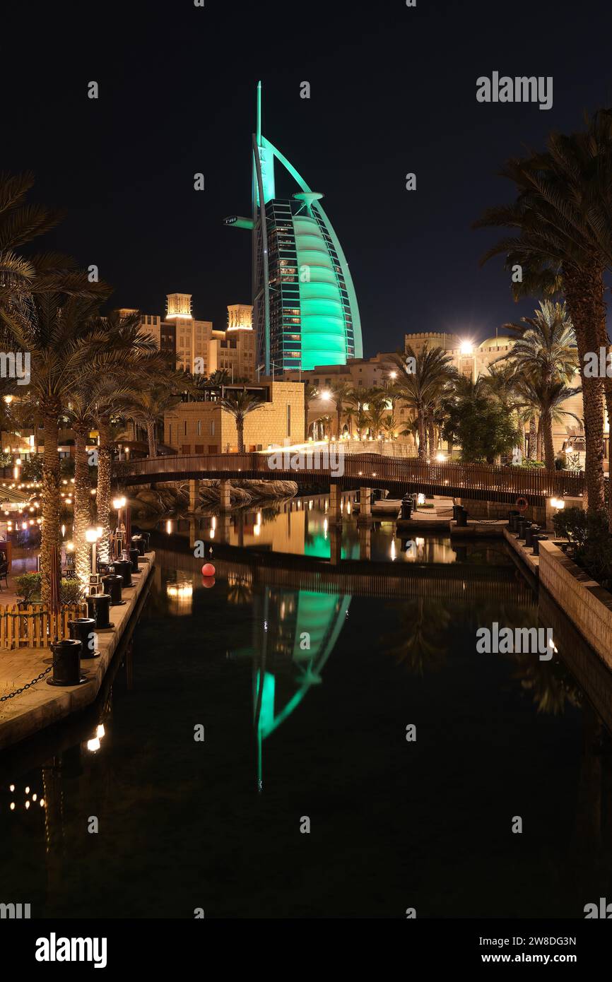 Night view of canal at Souk Madinat Jumeirah and illuminated Burj Al Arab, Dubai, United Arab Emirates Stock Photo